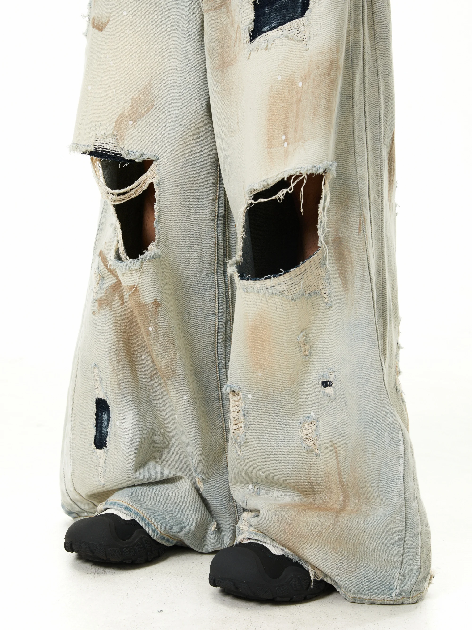 Niche Design moddergeverfde jeans met grote schade en wijde pijpen Amerikaanse retro gewassen dweilbroek