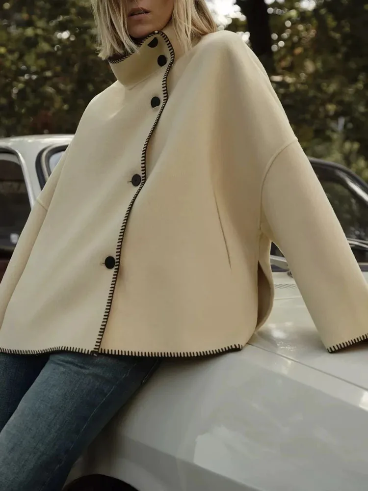 

Elegant Single breasted Solid Asymmetric Coats Casual Contrast Stitching Outercoats New Fashion Stand Collar Long Sleeve Jacket
