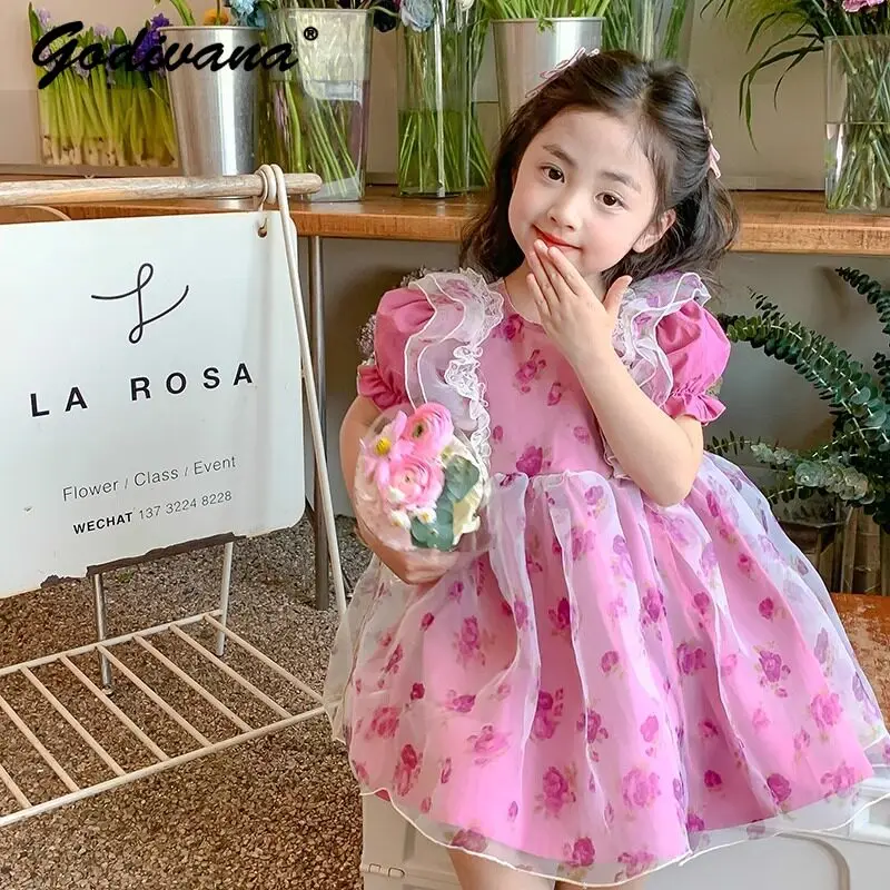 

Sweet Baby Girls Red Floral Print Princess Dress 2026 Summer New Kids Fashion Korean Puff Sleeve Tulle Patchwork Casual Dress