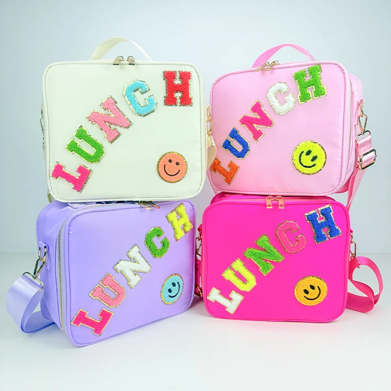 Popular nylon embroidered smiling face lunch bag with letter stickers hand-held picnic bag, outdoor portable insulated bento bag