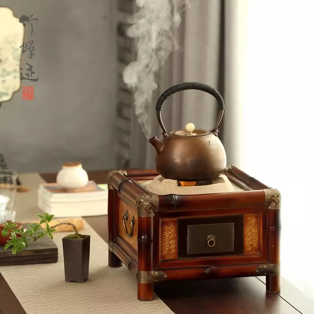 A tea stove made of antique bamboo charcoal stove, an iron pot for brewing tea, a heating furnace, and a warm tea stove