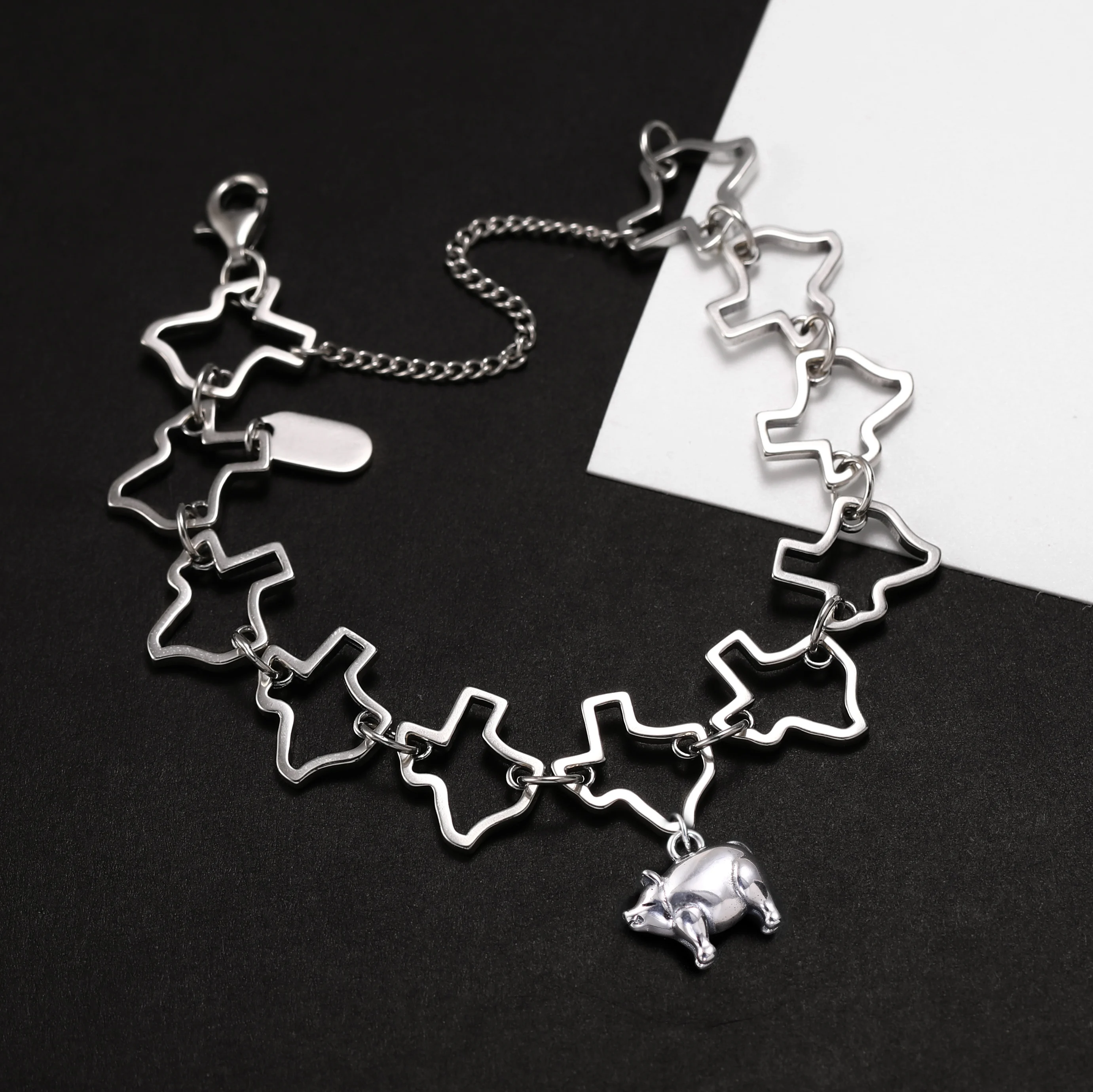 

Genuine 925 sterling silver Texas Charm Bracelet paired with a pig pendant