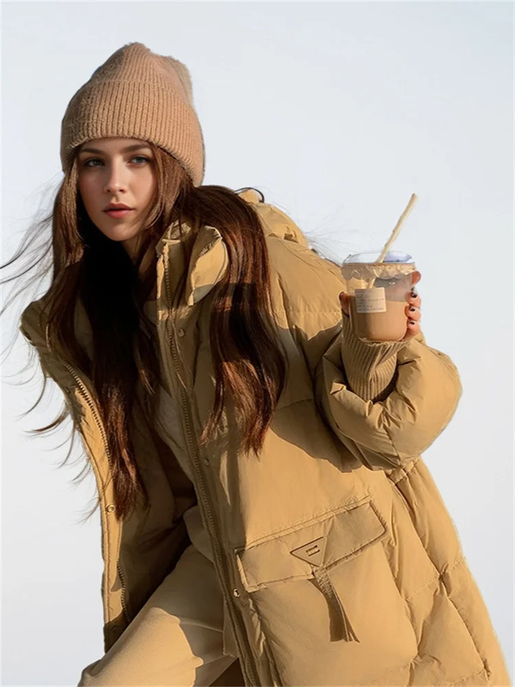 Piumini da donna inverno nuovi polsini lunghi ed eleganti con tasche con cappuccio grandi per il calore giacca imbottita allentata In inverno