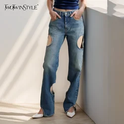 TWOTWINSTYLE Hollow Out Streetwear Denim Pant For Women High Waist Patchwork Button Vintage Full Length Pants Female New
