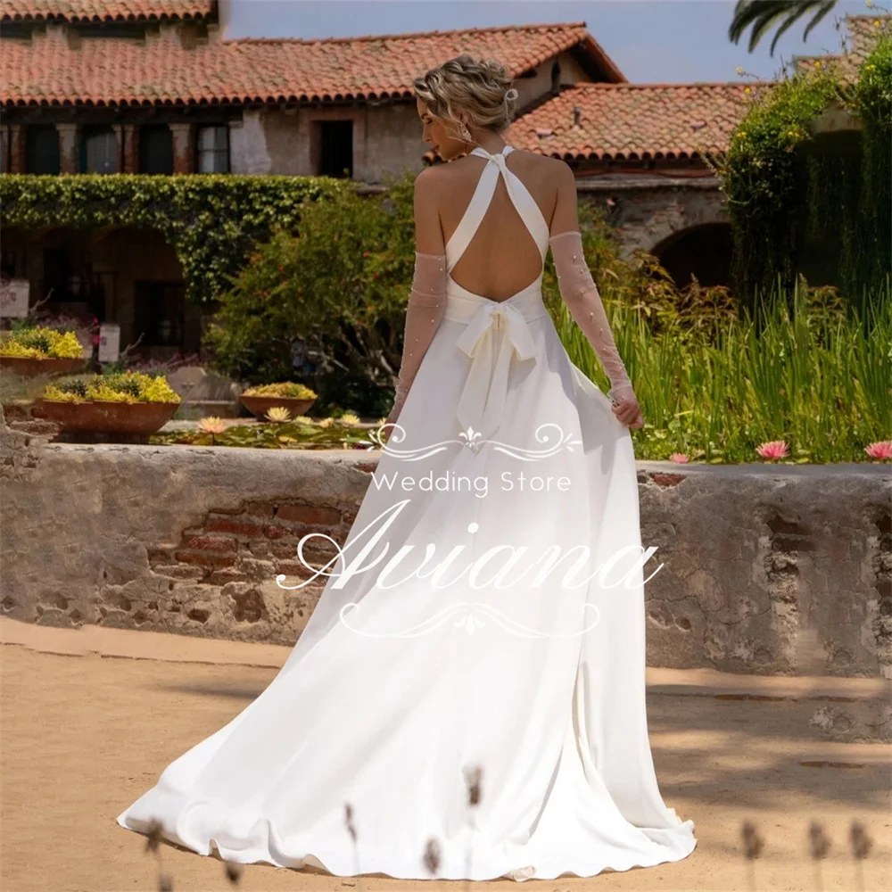 Aviana Customized Halter Neck Bridal Gown Open Back Design Sheer Sleeves Bow Detail Long Train Elegant New Design Charming 2025