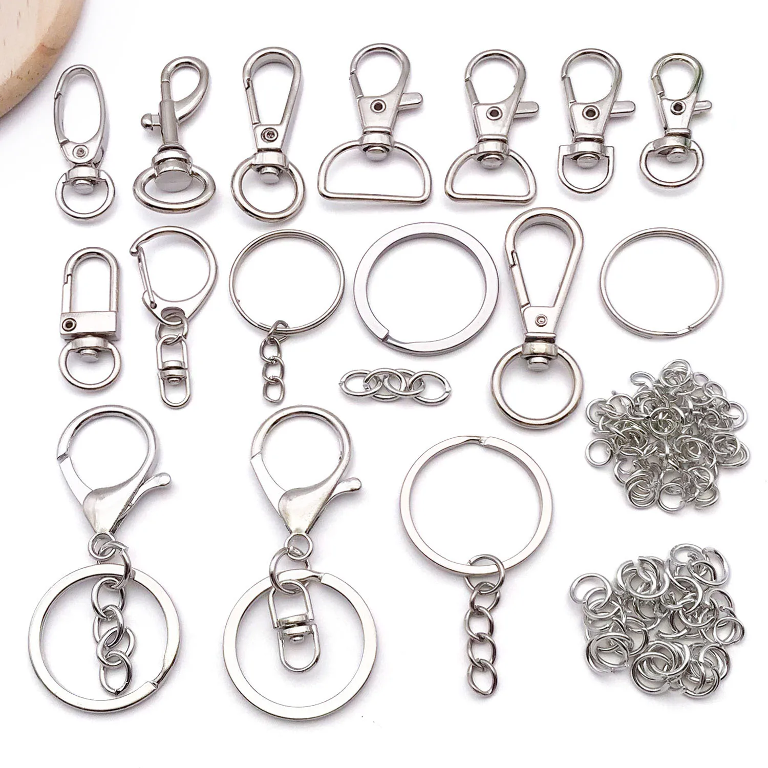Surtido de 19 llaveros, llaveros, cadenas y colgantes de aleación chapada en oro blanco para joyería de collar de pulsera DIY.