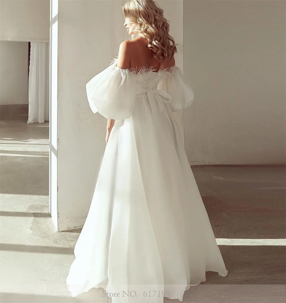 Robe de mariée longue en mousseline de soie à col bateau, plumes A-ligne, manches bouffantes parfaites, tout ce qui convient aux patients