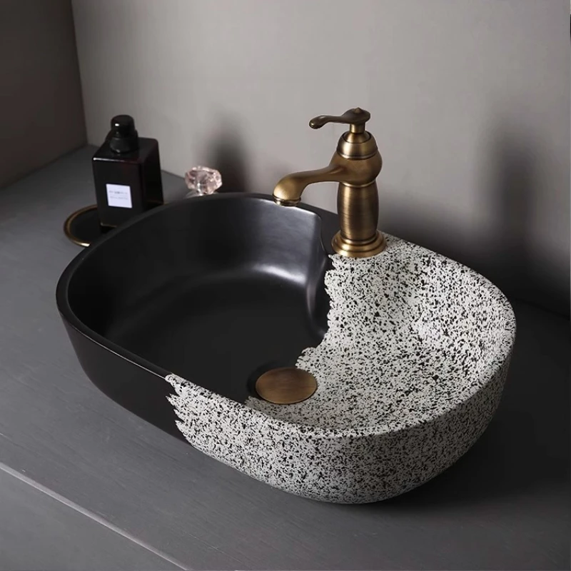 

Minimalist countertop basin Black and white ceramic wash basin Oval washbasin Personalized creative wash basin