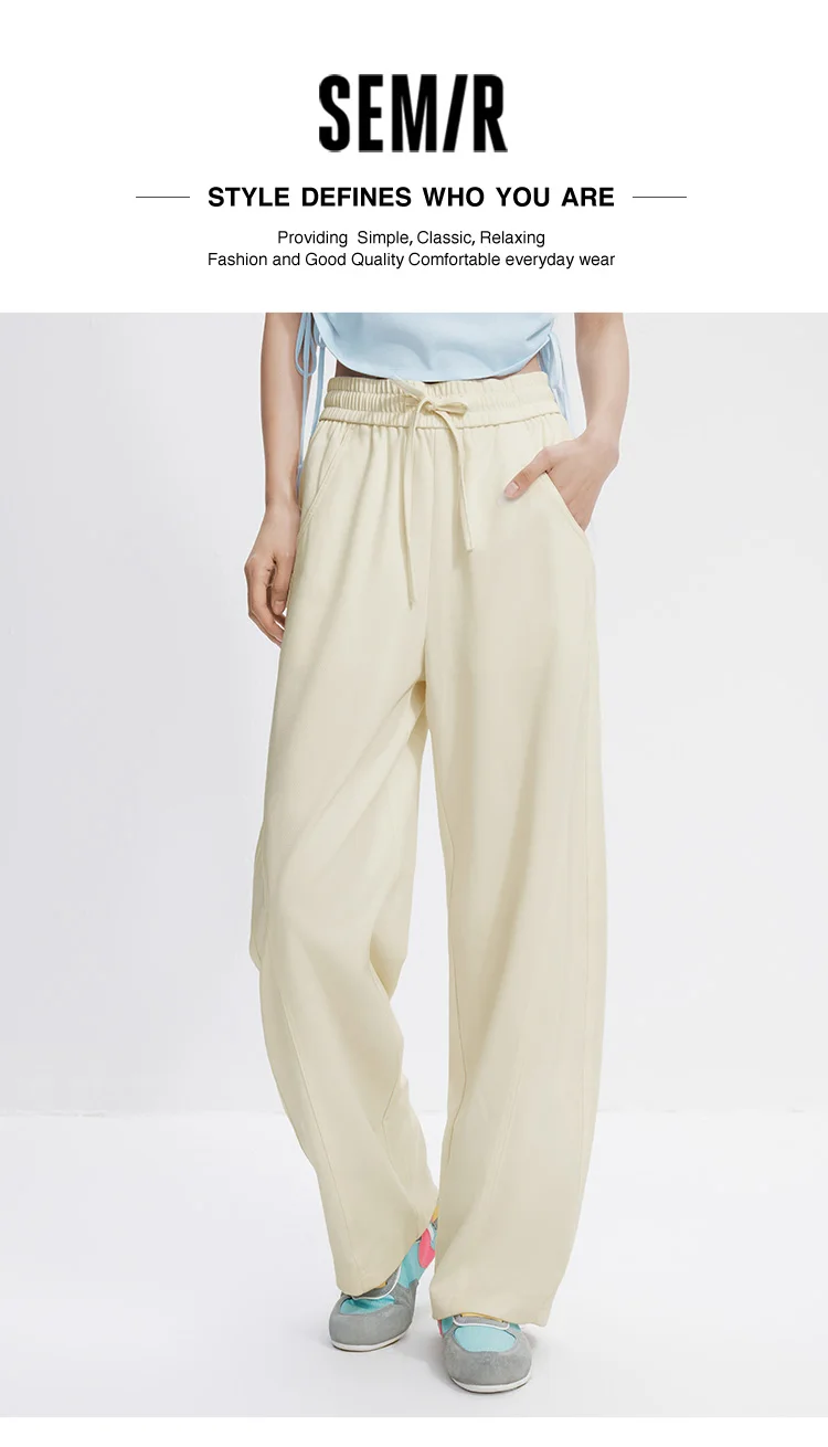 Damenhosen: Lässige, geschlitzte, lockere, geschwungene Slim-Fit-Hose im minimalistischen, vielseitigen Stil mit geschwungenem Bein – Sommermode 2026 für den Alltag – Detail 1