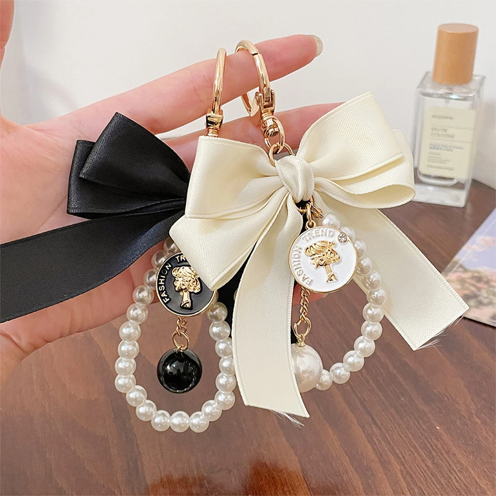 

Romantic Ribbon Bowknot Keychain Cute Faux Pearls Strings Engrave Figure Coin Enamel Pendant Keyring Women Bag Accessory Ornamen