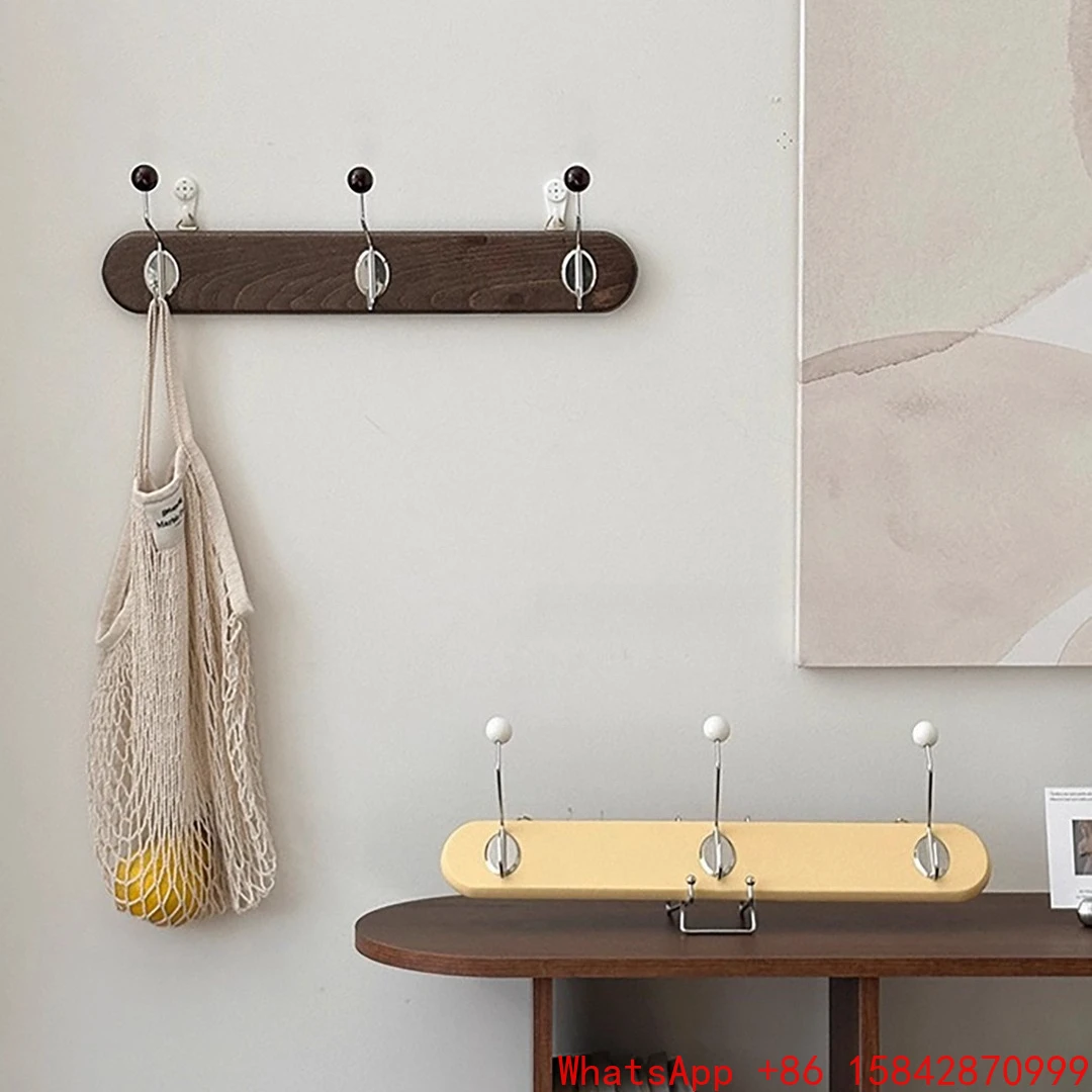 

Hanging clothes and hats, hanging hangers on the wall of the fitting room of the clothing store