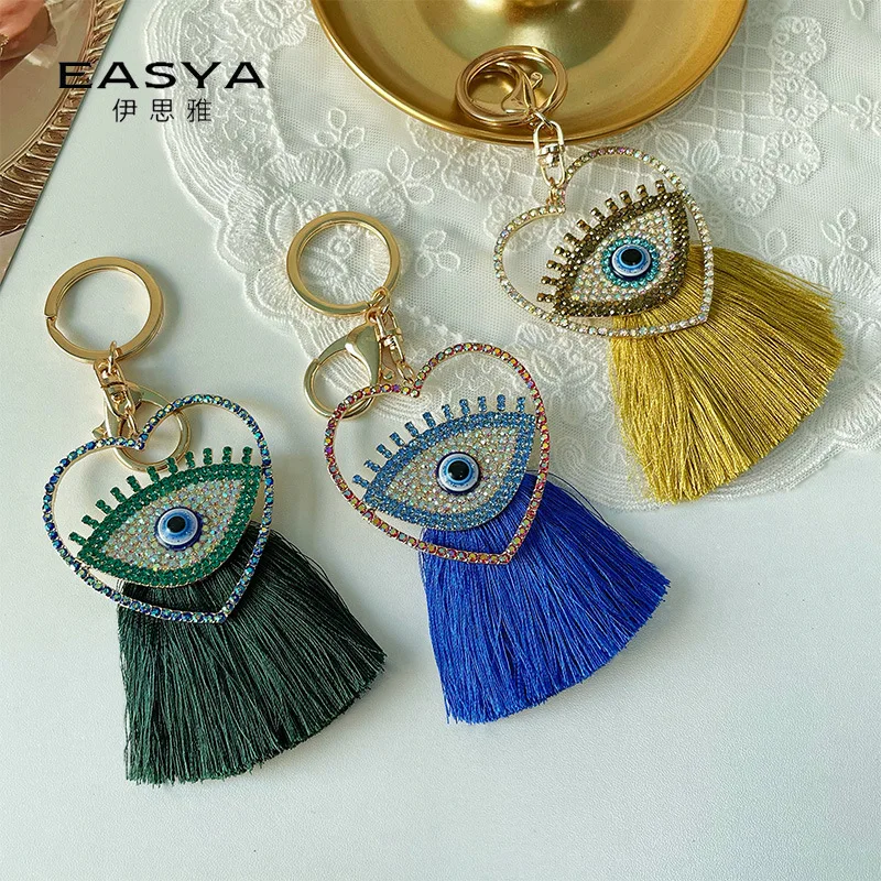 

European and American fashionable colorful blue eye tassel keychains, metal bags, pendants and small gifts