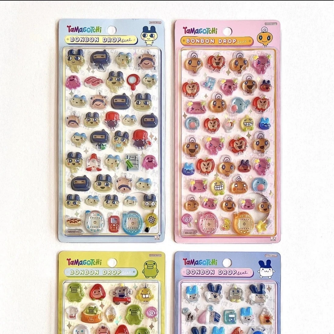 ملصقات Tamagotchii اللطيفة ثلاثية الأبعاد الإغاثة الكرتونية الطرفية جراب هاتف كاميرا شفافة كريستال حساب اليد ملصق اللعب