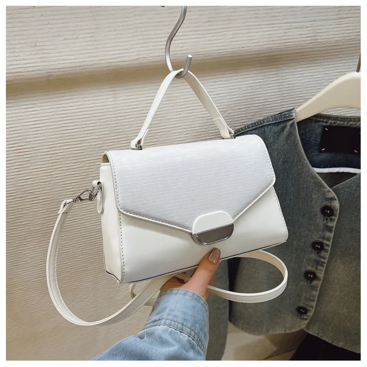 2025 ニッチクロスボディバッグ、ミニマリスト通勤用レディースバッグ、シックなトップハンドルトート、多用途デイナイトバッグ、テクスチャードスリング