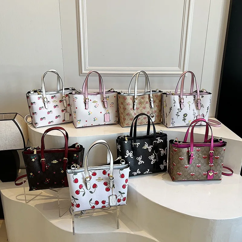 La nuova borsa da donna tote con motivo di marca di lusso del 2025 è una borsa a tracolla monospalla alla moda