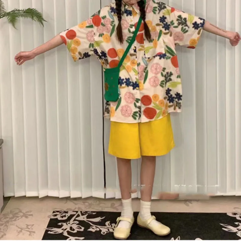 Camiseta de manga corta con bolsillos y botones para mujer, camisa holgada informal con estampado sencillo, estilo de vacaciones, novedad de verano