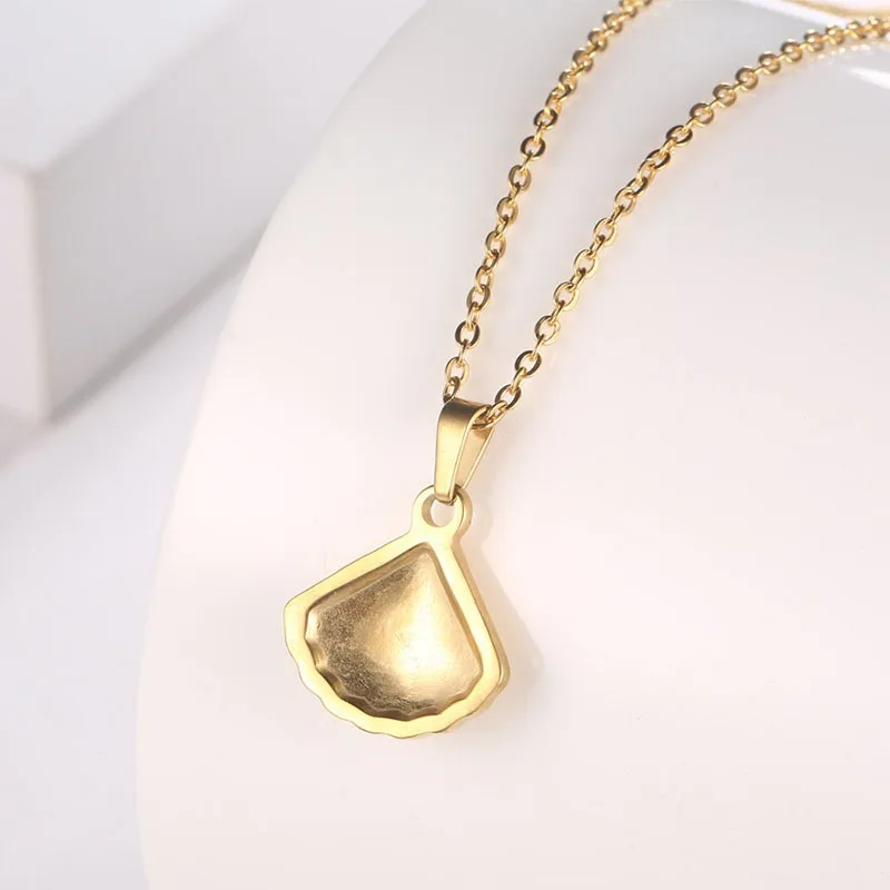 IMI الجنكة بيلوبا قلادة التيتانيوم الصلب قسط الفرنسية المتخصصة الإناث اللؤلؤ مروحة الترقوة الإضافية قذيفة YL030