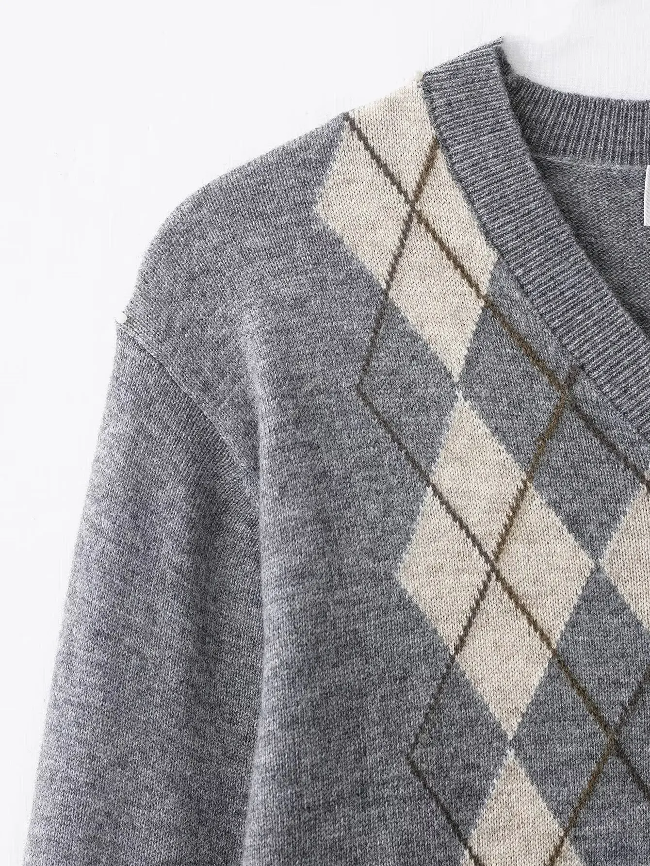 Nieuwe herfstvest voor dames Stijlvolle knoopsluiting V-hals Lange mouwen Slim-fit gebreide geruite trui Streetstyle damestop