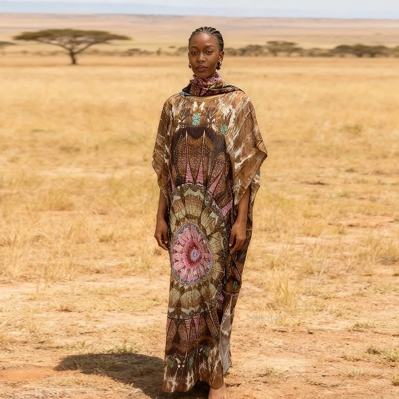 2026 Modieuze Afrikaanse vrouwen jurk rayon positionering hot boren afdrukken losse strand jumpsuit lange jurk groot formaat gewaad