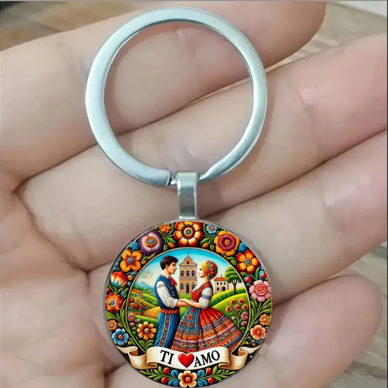 The theme is "Love, Romance, Fashion". Keychains, men and women wearing traditional clothing, holding hands, architecture, scene