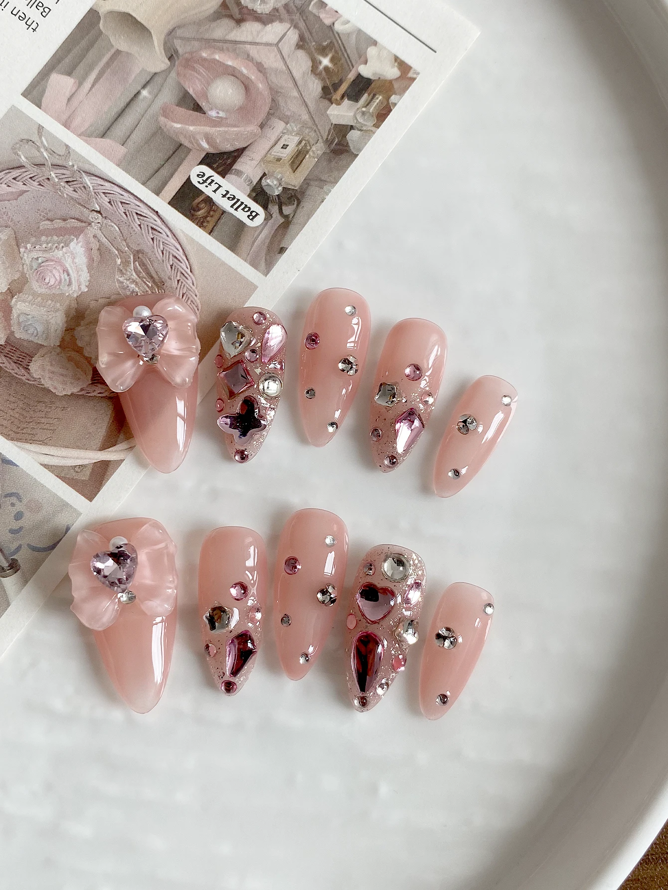 Long Stiletto Press‑On Nails, Natural Nude Pink Base, Handcrafted 3D Bow Ornament & Assorted Pink Heart Crystal Rhinestones