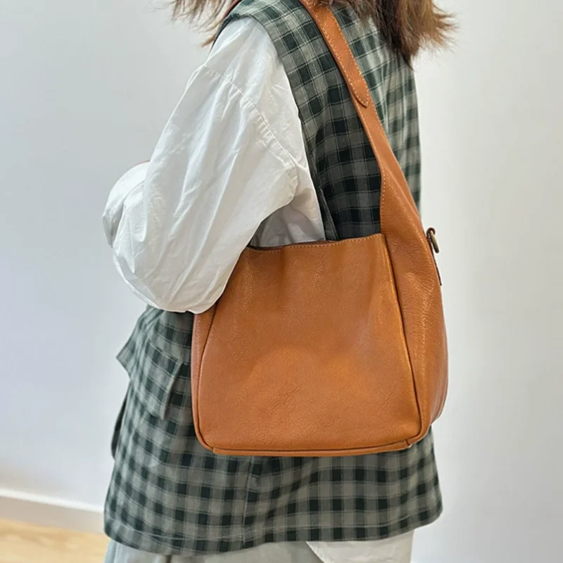 

Classic leather handbag women made of top-grade cowhide featuring a shoulder strap crossbody design new style bucket bag small