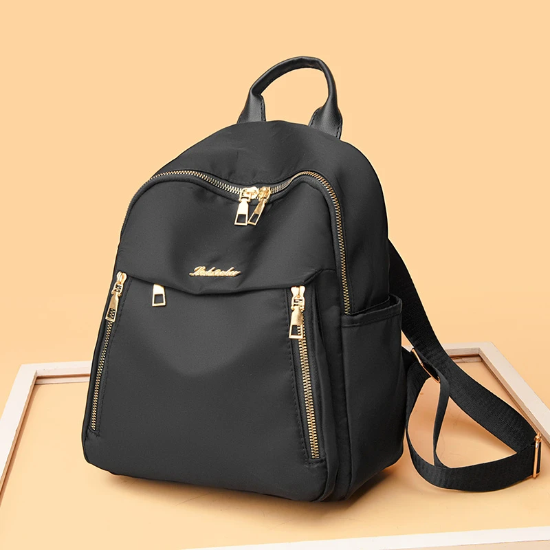 

1 women's travel backpack, large capacity Oxford cloth nylon backpack, with adjustable shoulder straps, black color, zipper clos