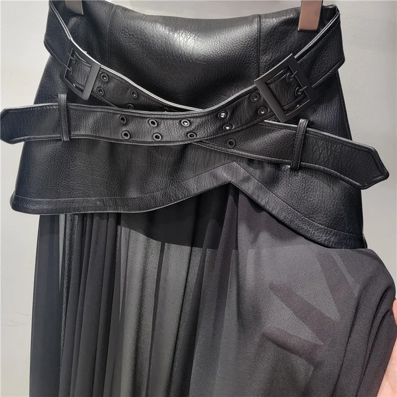 

Chic mesh & PU leather A-line skirt. Flowy high-low hem, edgy yet feminine. Versatile black statement piece.