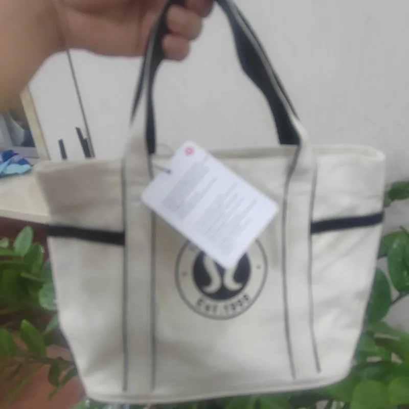 

Horizontal canvas portable student handbag, large capacity, carried by a single initiative, cross carried, urban minimalism