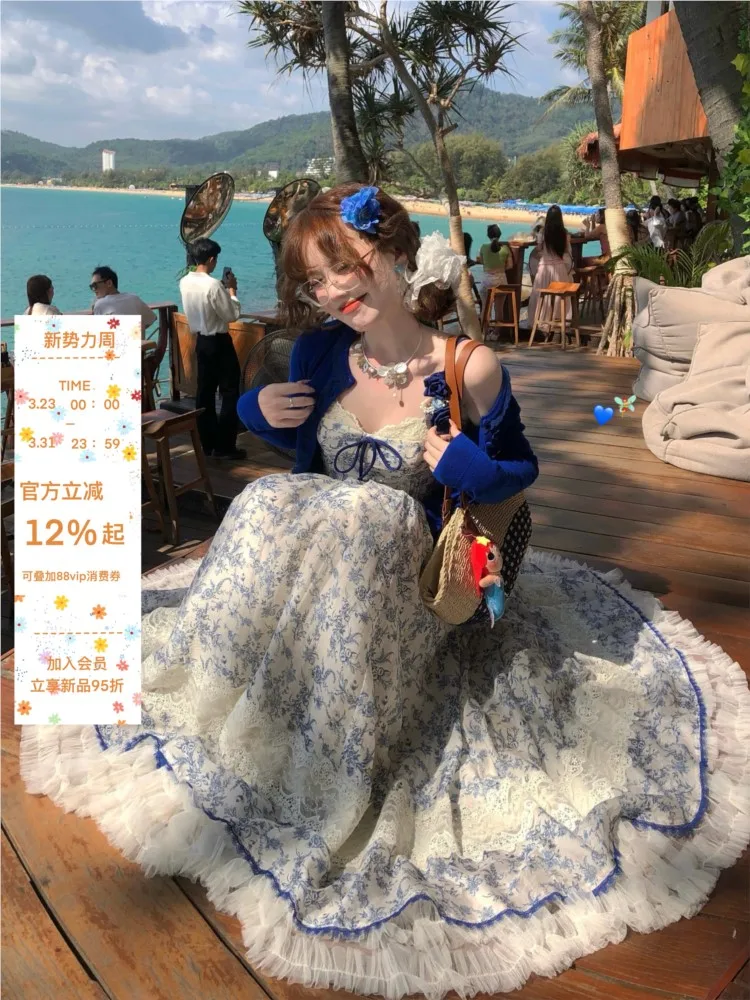 

Two blue and white waist-cinching false halter long dress cardigans