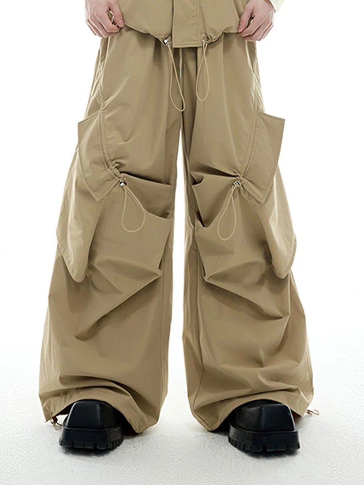 

Mauroicardi Весенние черные струящиеся мешковатые широкие брюки-карго для мужчин с карманами на шнурке и эластичной резинкой на талии цвета хаки, уличная одежда штаны широкие штаны оверсайз