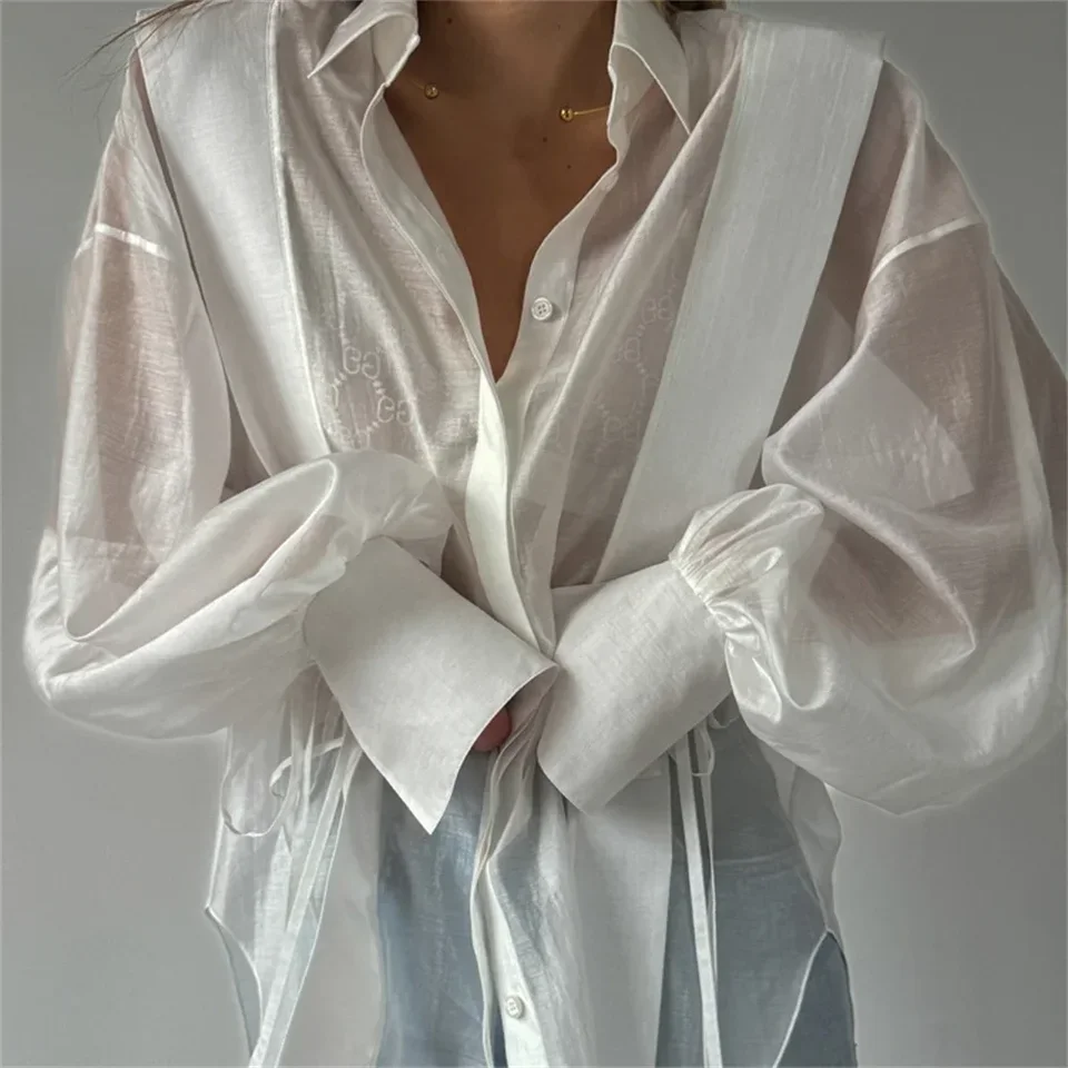 ファッションホワイトコットンシャツ女性2025夏シースルーカジュアルラペル長袖ブラウスレースアップルーズトップ女性服