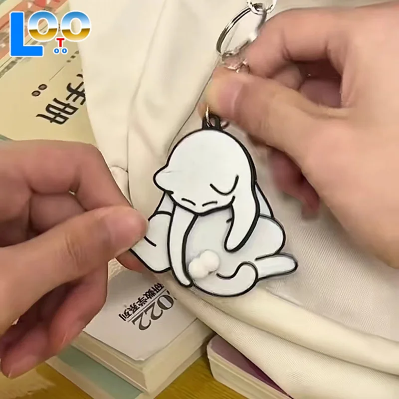 1pcs เล่นดึงไข่แมวพวงกุญแจจี้น่ารักและตลกหมุนได้อะคริลิคกระเป๋าจี้สําหรับผู้หญิงพวงกุญแจกระเป๋าอุปกรณ์เสริม
