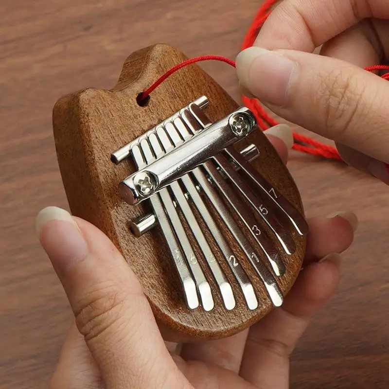 Mini Kalimba 8 teclas pulgar Piano exquisito dedo pulgar Piano Marimba Musical buen accesorio colgante regalo ﻿ para niños
