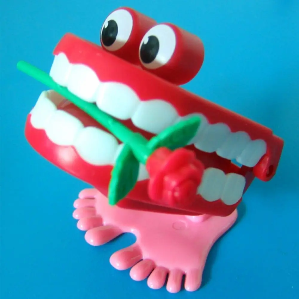 Simpatica protesi per bambini che chiacchiano, divertente giocattolo a orologeria, denti rosa, carica a orologeria, giocattolo a forma di denti da passeggio