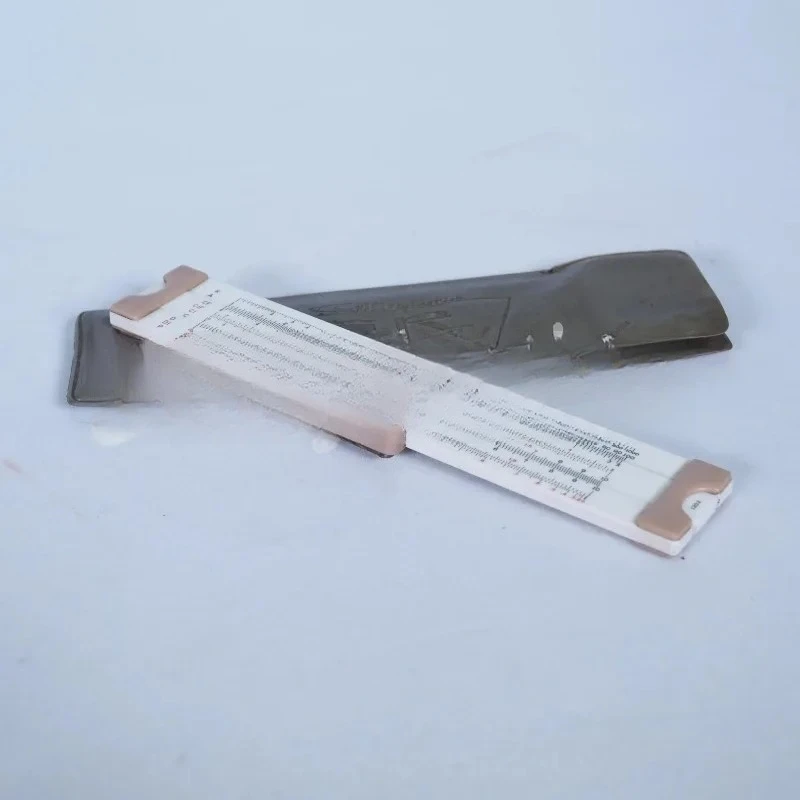 Logarithmic Slide Rule: Nostalgic Old Object, Folklore Ornament & Classic Calculator