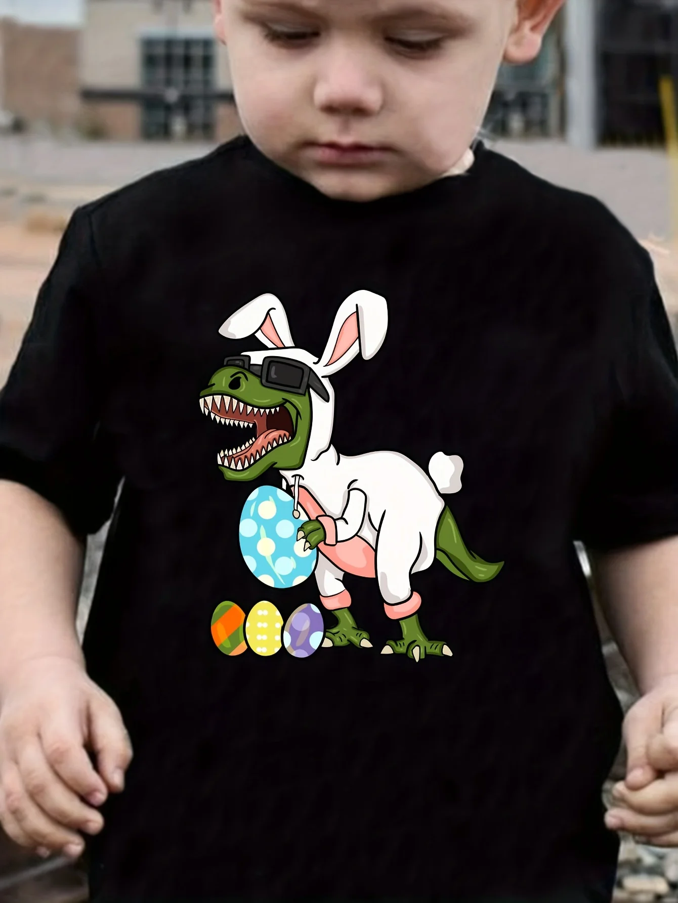 Fun St. Patrick’s Day festive design, cute dinosaur graphic decorated with bunny ears, playful novelty look for boys
