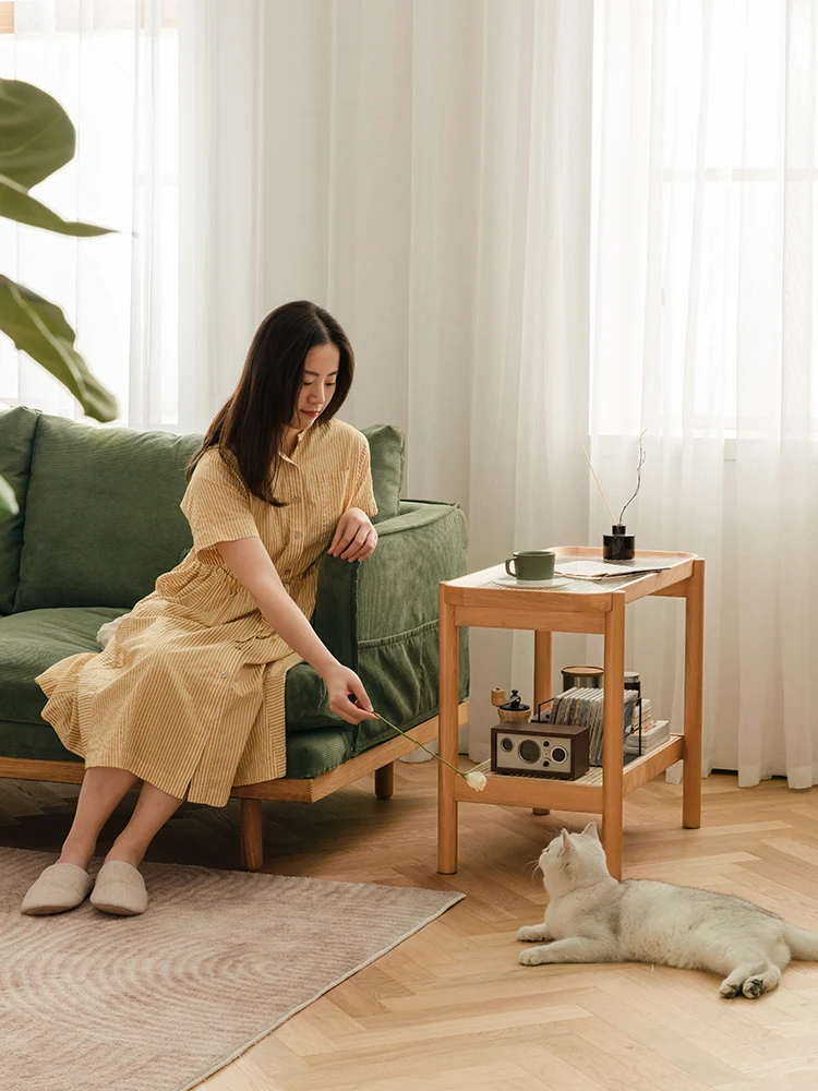 A few rattan woven solid wood, white oak, cherry wood, logs, colors, corners and glasses beside the sofa.