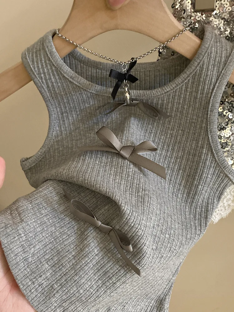 Girls\' bow knit vest Korean version of children\'s wear 2024 summer new temperament lace splicing sequin short skirt tide