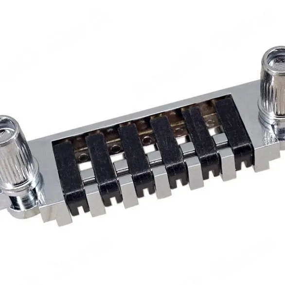 

Электрогитара LP EPI со встроенным бриджем, хвостовиком, бриджем и откидными мостовыми седлами.