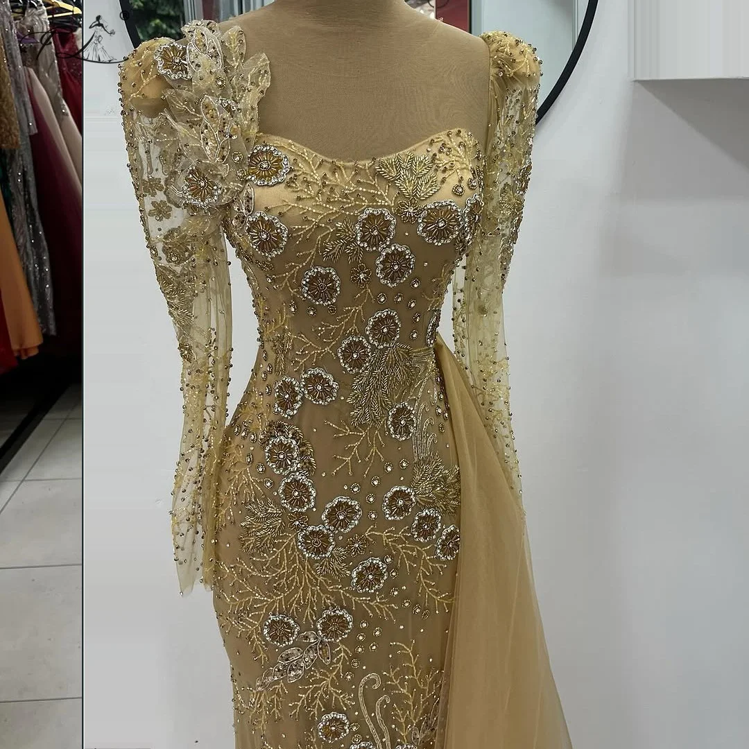 Mermaid evening dress with rhinestone flower bead embellishment side tulle train long sleeves champagne gold long ball gown