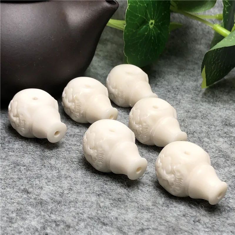 

Factory Supply Ivory Nut Integrated Tee Beast Faucet Water Drop Pagoda18mmOne piece dropshipping