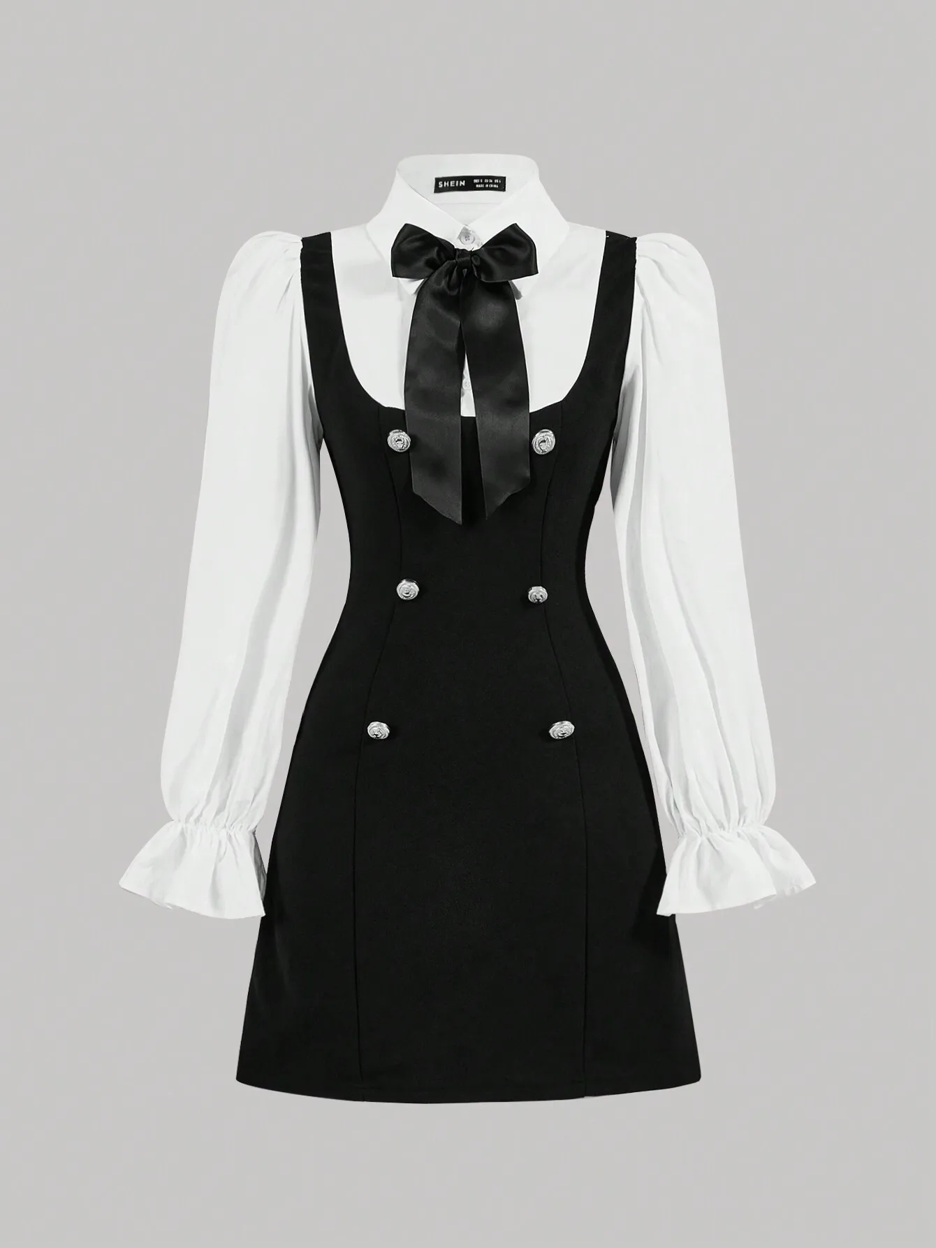 

Черно-белое двубортное платье с бантом и пышными рукавами