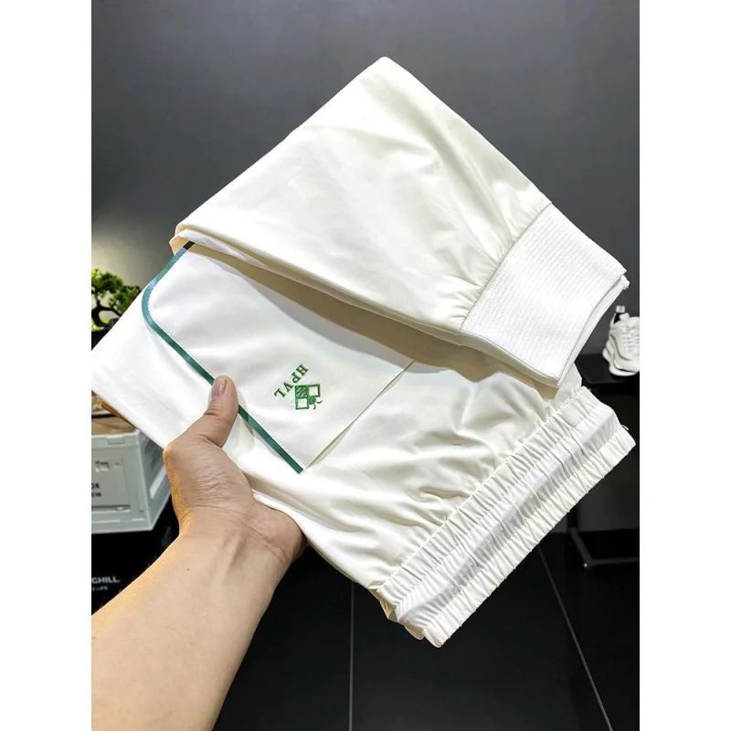 Summer high end light luxury thin silky soft fashion slim fit tie feet large black ice silk elastic sports MEN'S casual pants