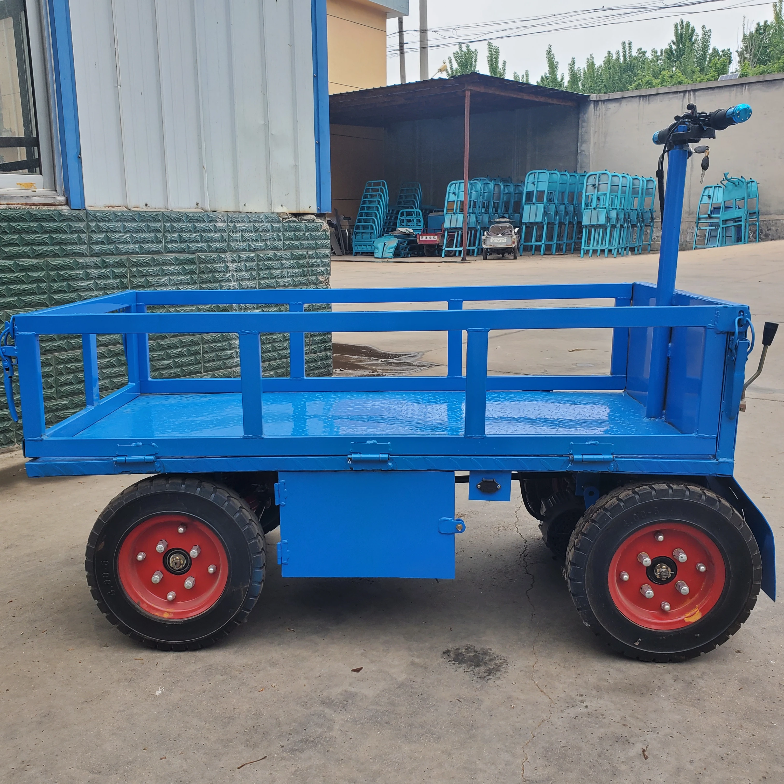 Electric cargo platform vehicles equipped with fencing to facilitate the transportation of materials at the construction site