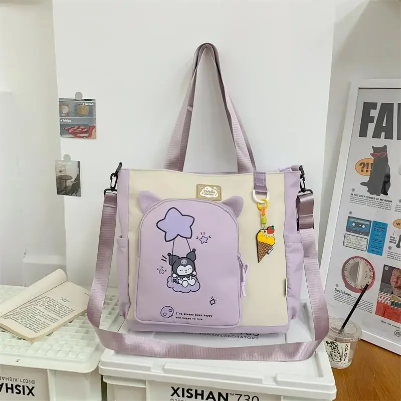 The new Sanrio large-capacity student class hand-held versatile portable shoulder make-up bag pink Kulomie commuter tote bag