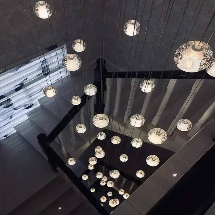 Modern light luxury crystal long chandelier duplex building minimalist living room hollow height simple villa lamps