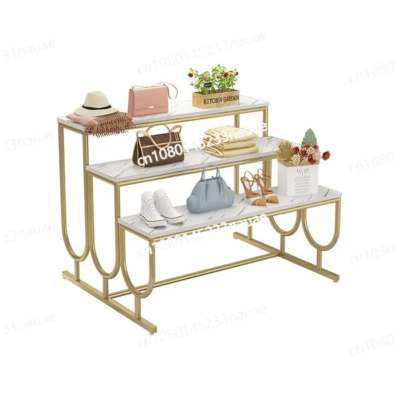 

Clothing store island display rack display props in the middle, high and low shoe bag store shoe rack ladder style flow table di