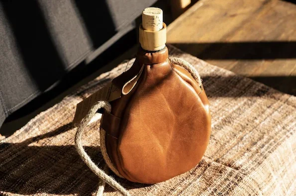 A century-old classic traditional handmade leather kettle water bag wine jug