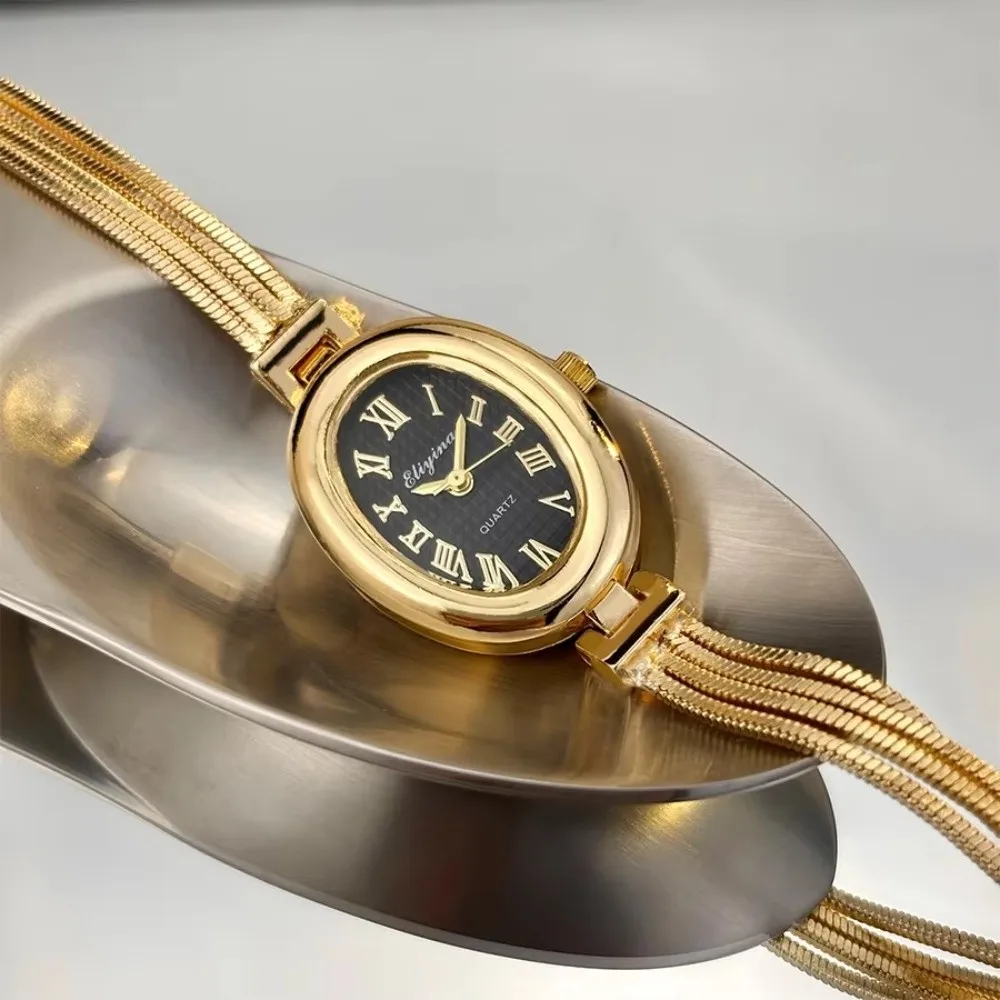 Gold Plated Bracelet Watch Roman Numerals Tassel Chains Ladies Watch Quartz Movement Antique Finish Oval Dial Watch For Women